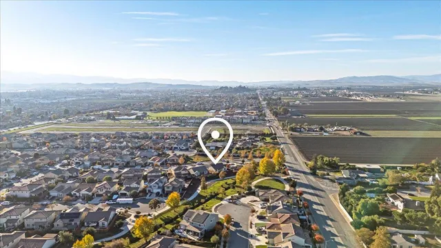 an aerial view of residential houses with yard