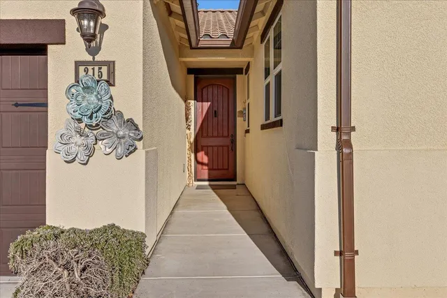 a view of a hallway with wooden floor and entryway