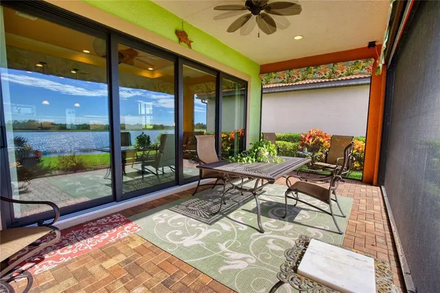 a view of swimming pool with outdoor seating