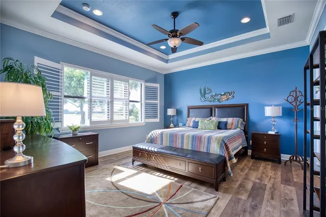 a bedroom with a bed and a night stand