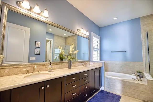a bathroom with a tub and shower