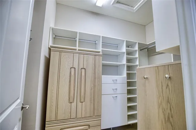 a bathroom with a glass door shower and a sink