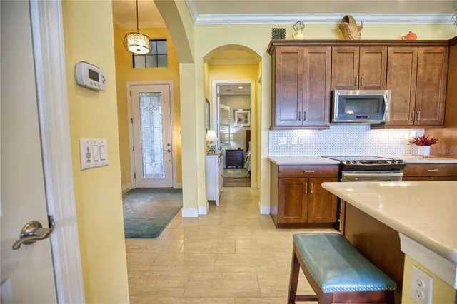 a bedroom with a bed and a large window with the outer view