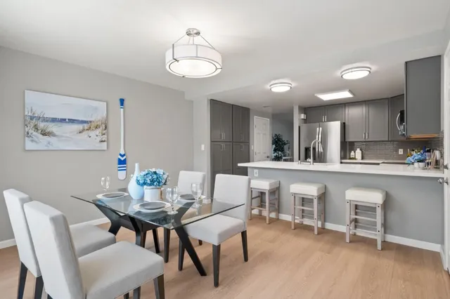 a view of a dining room with furniture and wooden floor