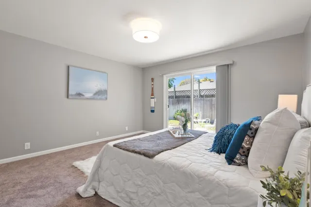 a bedroom with a large bed and a window