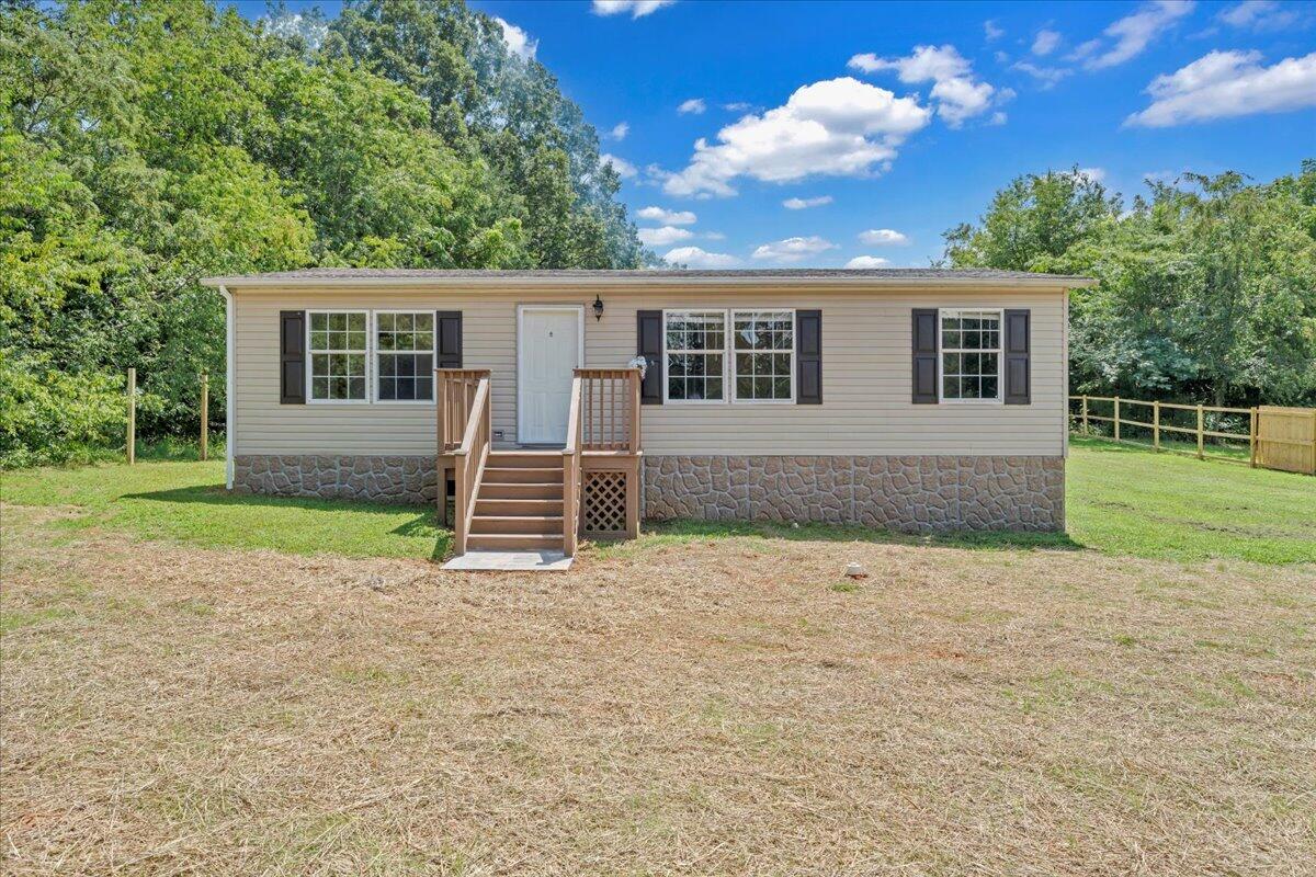 a backyard of a house with barbeque oven