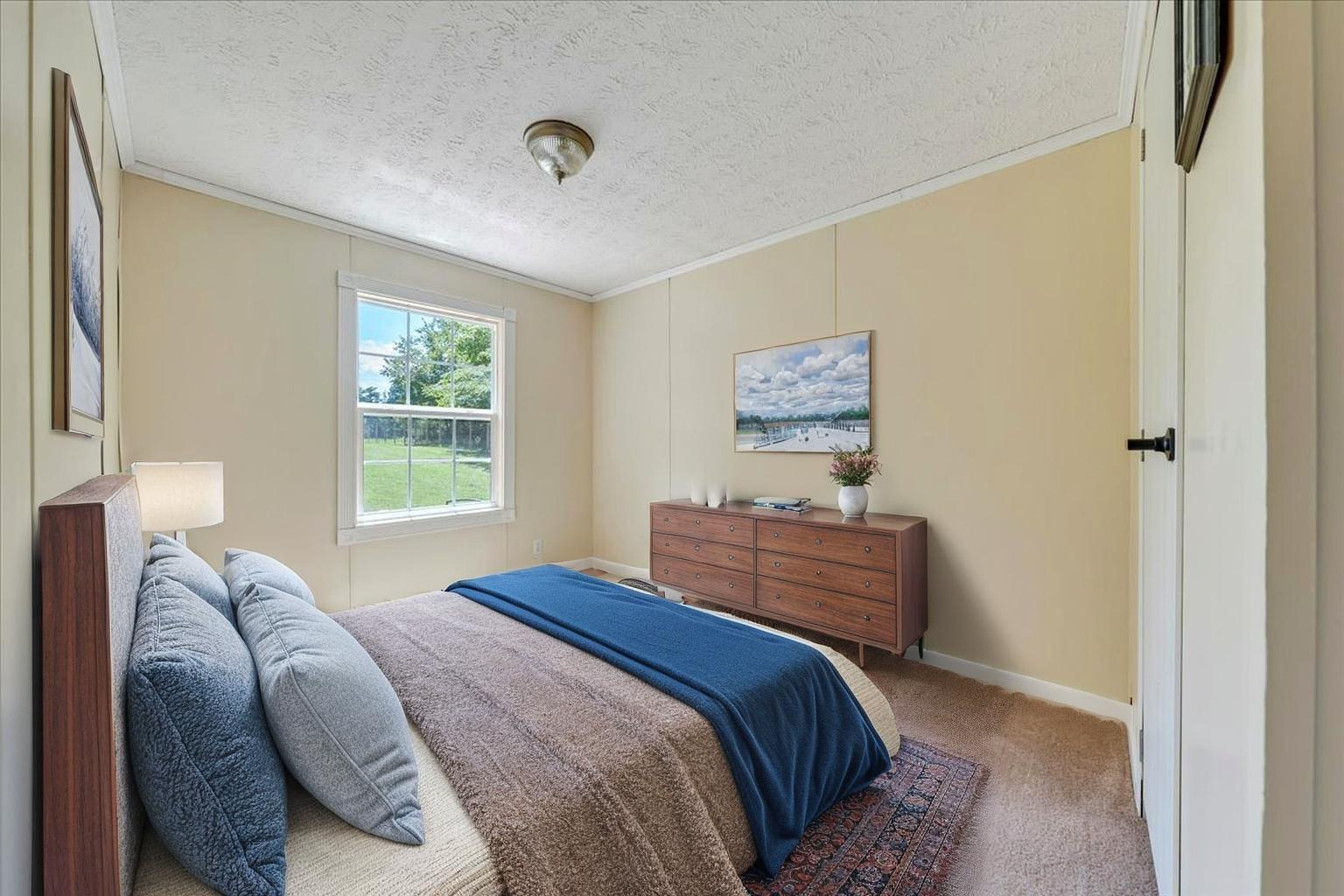 6638 Stewartsville Road Moneta, VA 24121 - Photo 10 of 27 a bedroom with a bed and a window