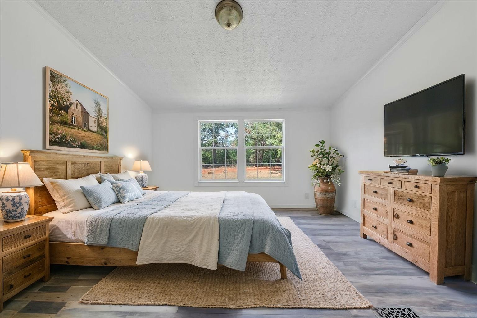 6638 Stewartsville Road Moneta, VA 24121 - Photo 15 of 27 a bedroom with a bed and a flat screen tv