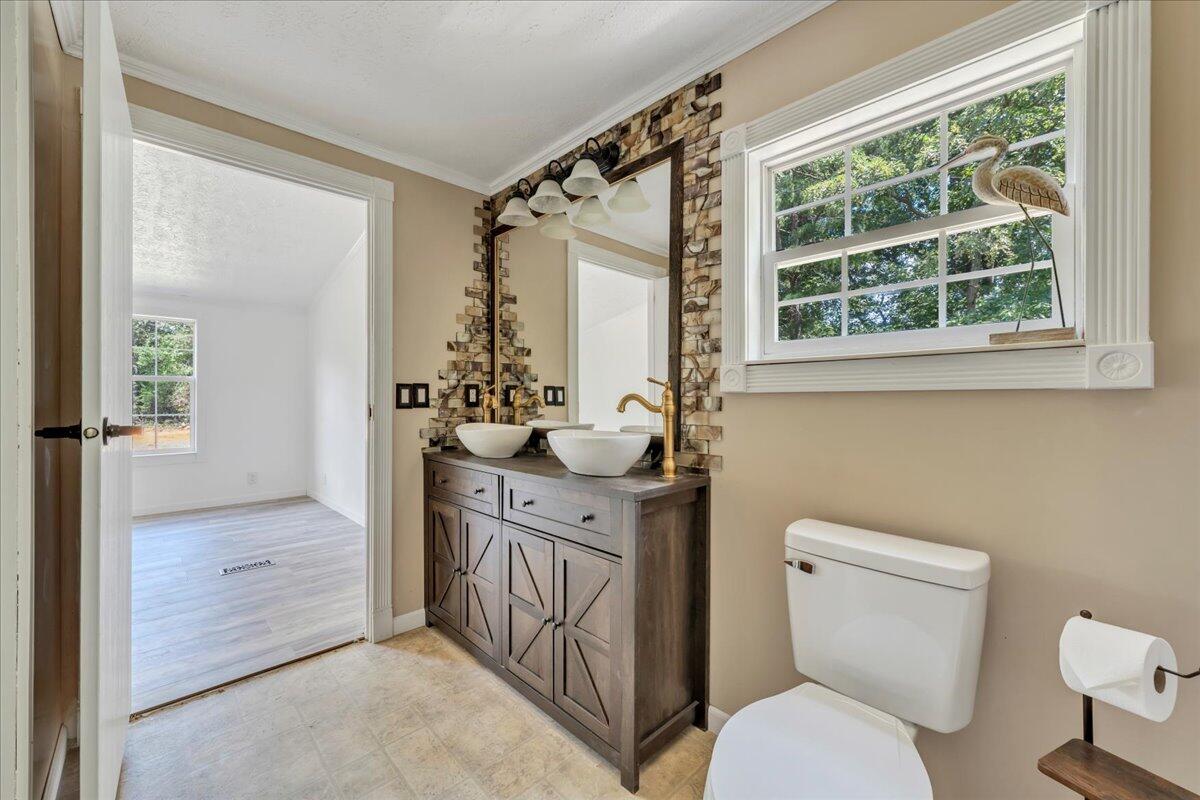 6638 Stewartsville Road Moneta, VA 24121 - Photo 17 of 27 a bathroom with a sink a toilet and shower