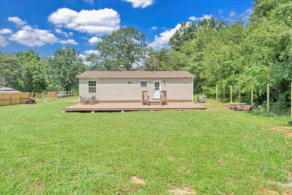 6638 Stewartsville Road Moneta, VA 24121 - Photo 22 of 27 a view of a house with a backyard porch and sitting area