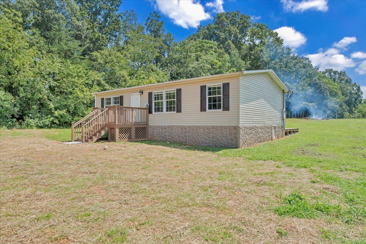 6638 Stewartsville Road Moneta, VA 24121 - Photo 26 of 27 a house with trees in the background