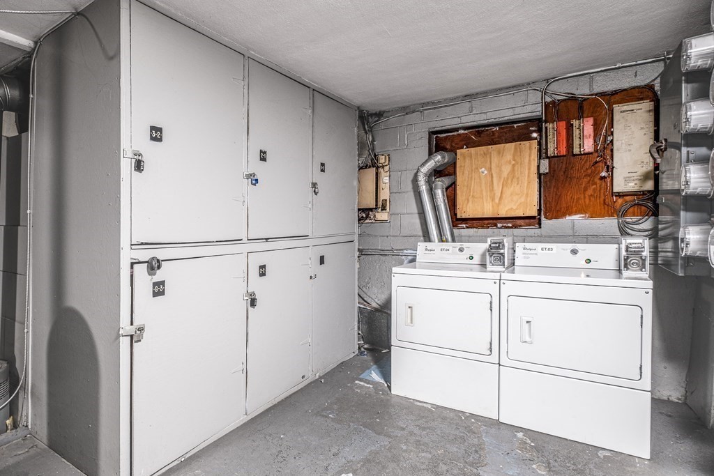 14 Riverside Street, Unit G3 Watertown, MA 02472 - Photo 11 of 18 a room with dryer and washer