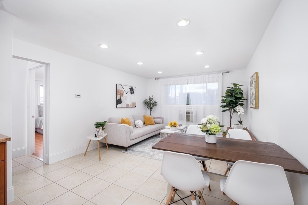14 Riverside Street, Unit G3 Watertown, MA 02472 - Photo 3 of 18 a living room with furniture and wooden floor