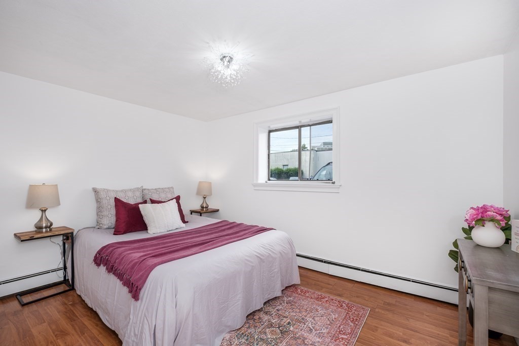 14 Riverside Street, Unit G3 Watertown, MA 02472 - Photo 7 of 18 a bedroom with a bed and a window