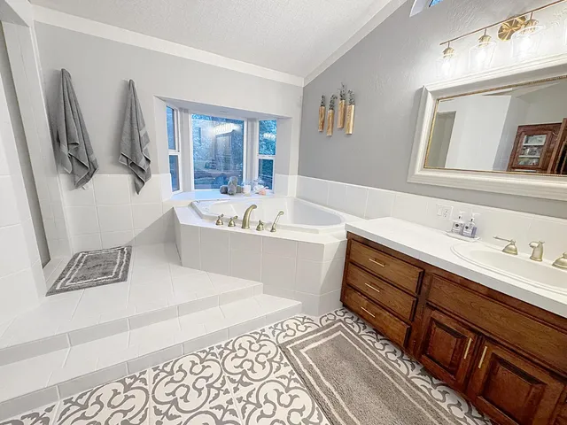 a bath room with a sink and a mirror