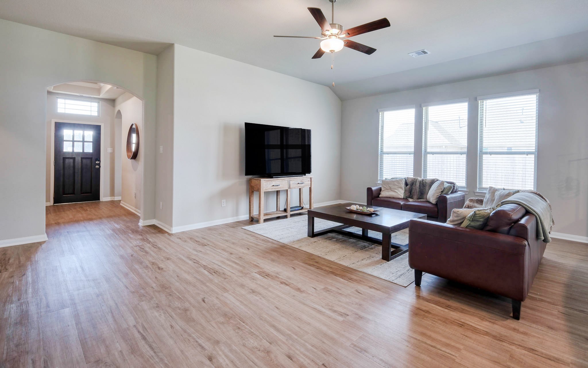 16747 Rockwall Street Conroe, TX 77303 - Photo 12 of 50 a living room with furniture and a flat screen tv