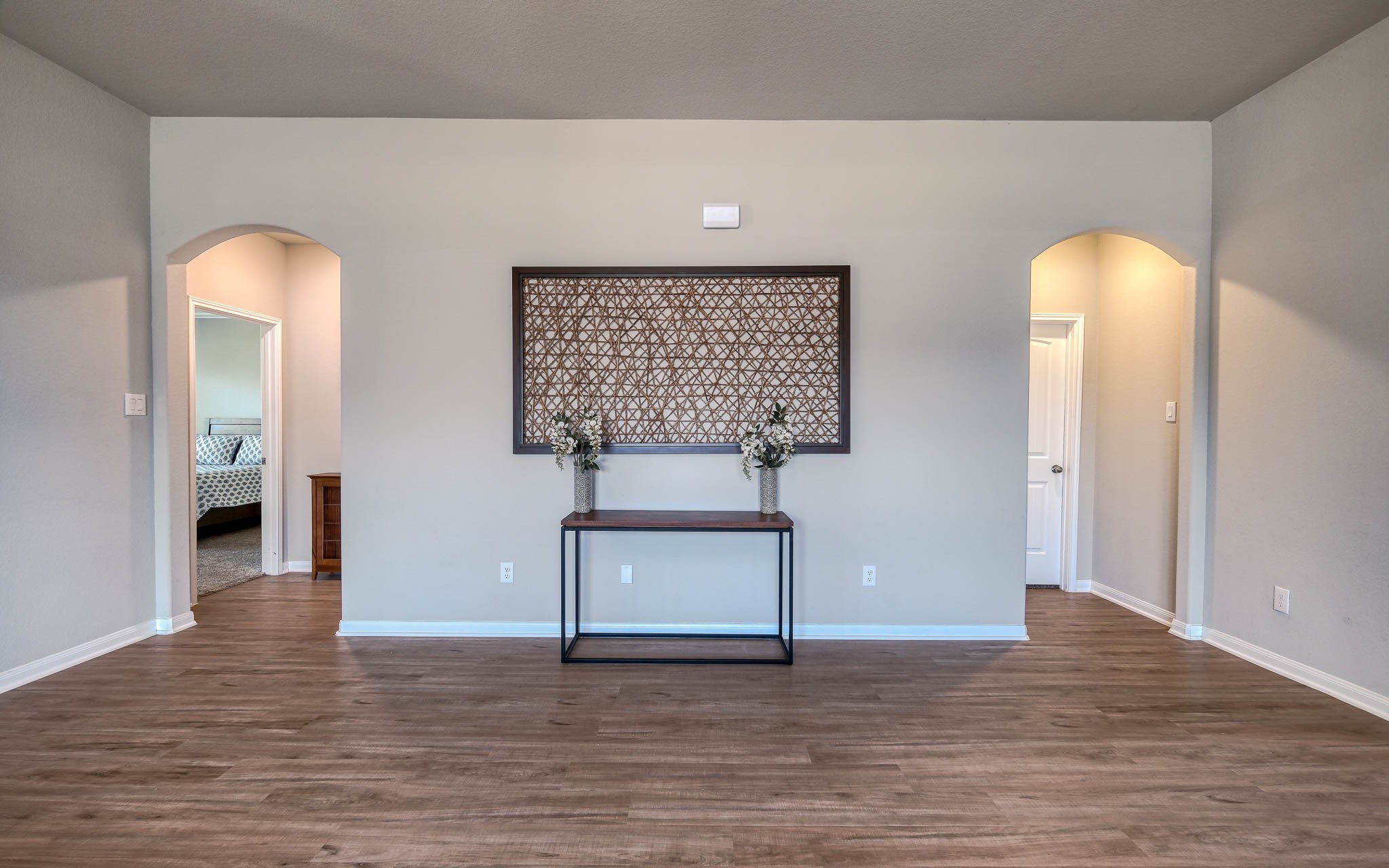 16747 Rockwall Street Conroe, TX 77303 - Photo 13 of 50 Same living area -- different view to accent how spacious this room is! Front to back, this .99 acre has so many possibilities and awaits your imagination. 16747 Rockwall St, 77303 features .9 partially cleared acre, stone and brick home built in 2023. Well cared for, and ready to grow your dreams!
