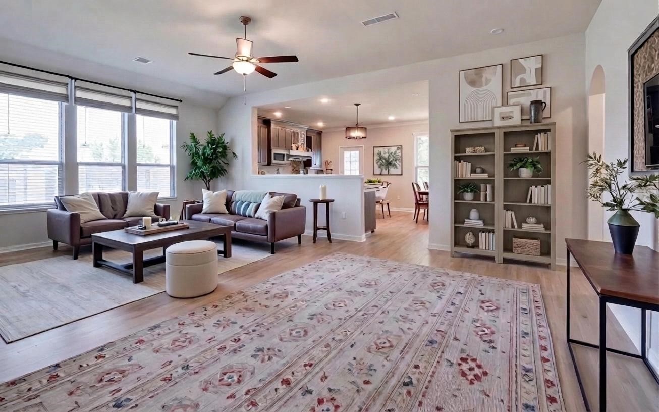 16747 Rockwall Street Conroe, TX 77303 - Photo 2 of 50 a living room with furniture a window and bookshelf