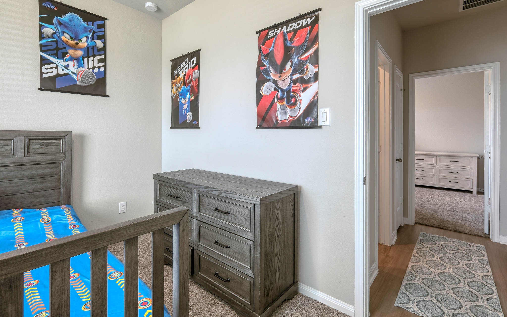 16747 Rockwall Street Conroe, TX 77303 - Photo 33 of 50 Bedrooms 3 and 4 sit next this hall bath, featuring shower/tub combination bath. Front to back, this .99 acre has so many possibilities and awaits your imagination. 16747 Rockwall St, 77303 features .9 partially cleared acre, stone and brick home built in 2023. Well cared for, and ready to grow your dreams!