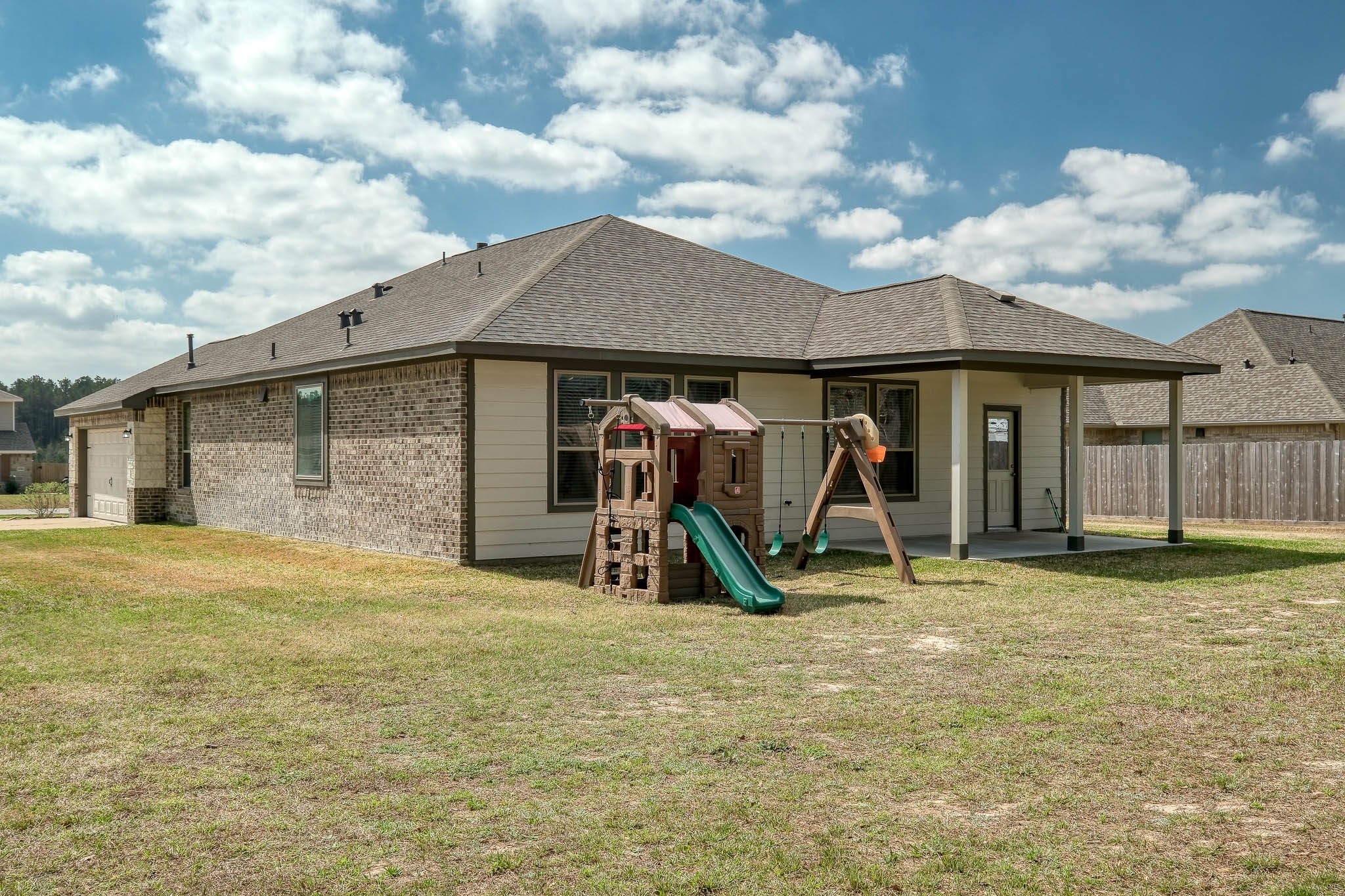 16747 Rockwall Street Conroe, TX 77303 - Photo 38 of 50 Side entry garage is convenient and elevates the front appearance. Playset is excluded. 16757 Rockwall St.