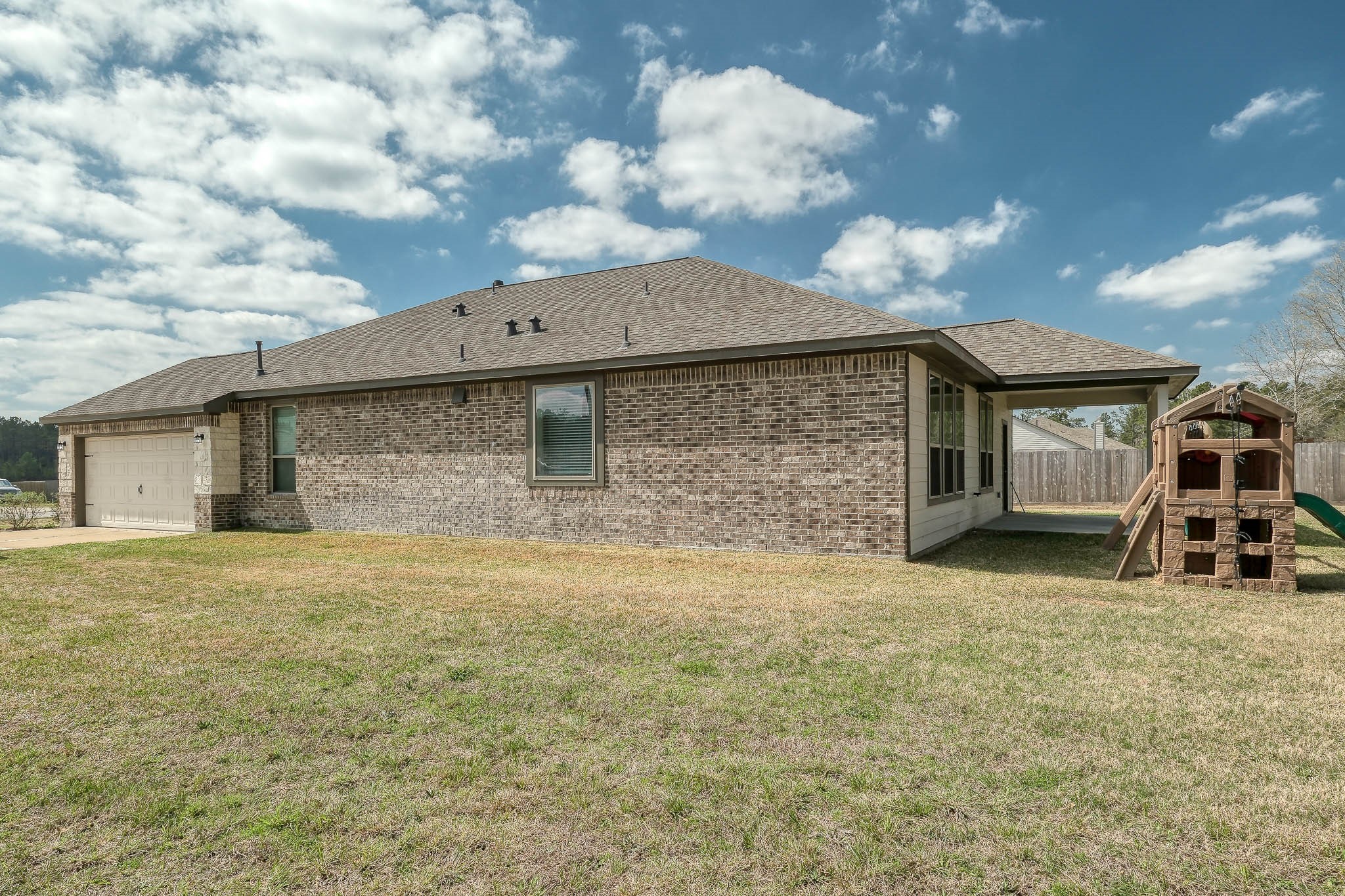16747 Rockwall Street Conroe, TX 77303 - Photo 39 of 50 a front view of a house with yard