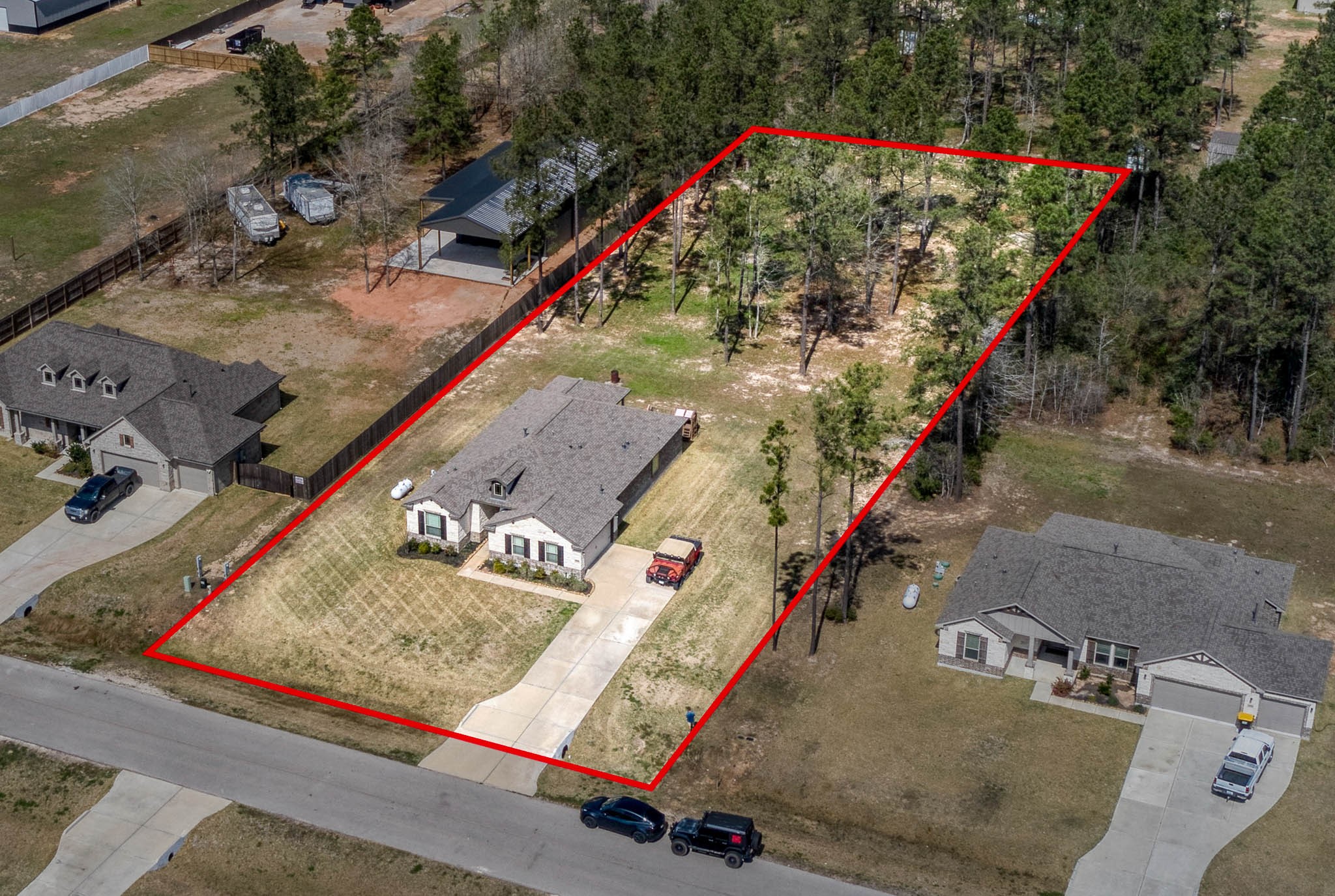 16747 Rockwall Street Conroe, TX 77303 - Photo 5 of 50 Nice symmetrical lot with available survey. Ready to build your barn, shop or pool. 16747 Rockwall St, 77303 features .9 partially cleared acre, stone and brick home built in 2023. Well cared for, and ready to grow your dreams!