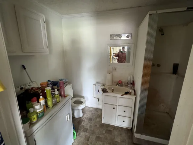 a room with cabinets and wooden floor