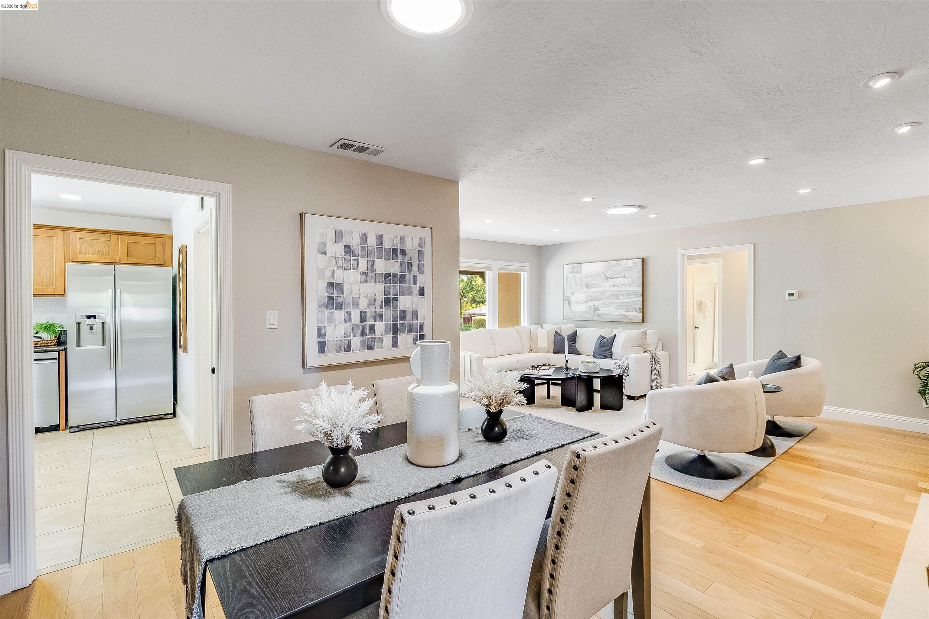 346 Valley View Road Pleasant Hill, CA 94523 - Photo 13 of 57 Open-concept living and dining area featuring recessed lighting, light wood-finish flooring, and light-toned walls