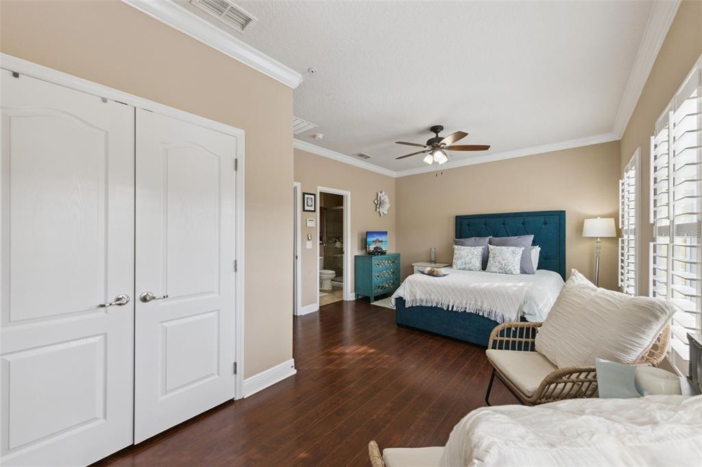 607 Pensacola Lane Lake Mary, FL 32746 - Photo 16 of 35 a bedroom with a bed and wooden floor