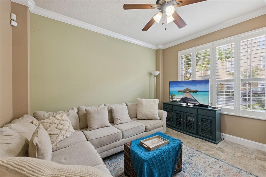 607 Pensacola Lane Lake Mary, FL 32746 - Photo 19 of 35 a living room with furniture ceiling fan and a window