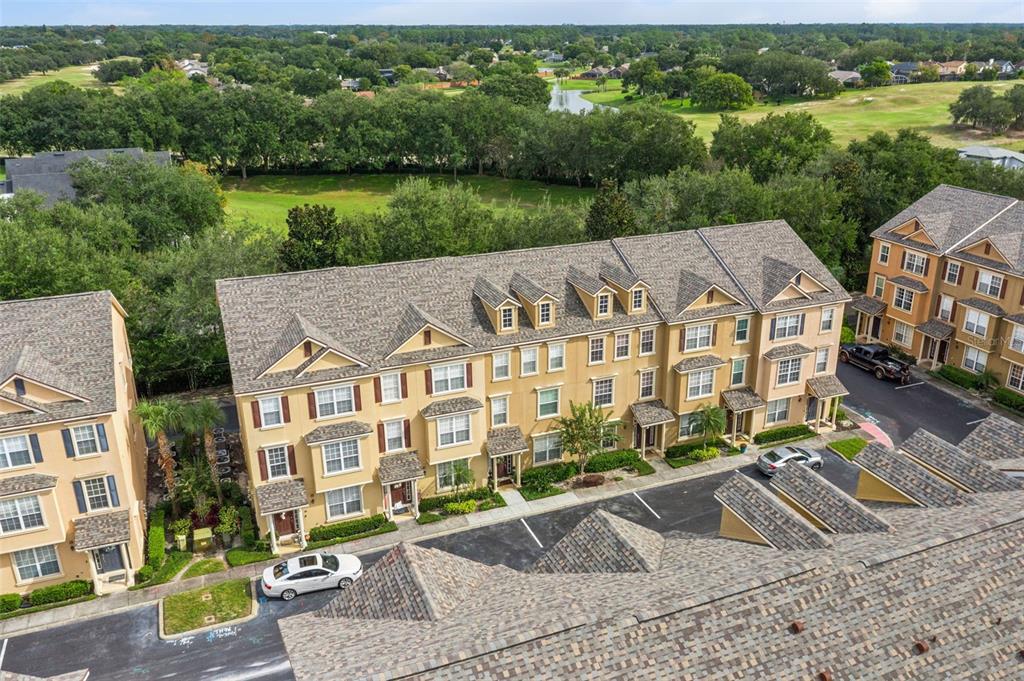 607 Pensacola Lane Lake Mary, FL 32746 - Photo 33 of 35 an aerial view of a house with a garden and lake view