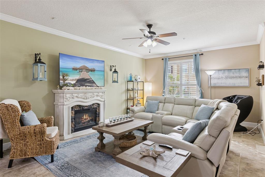 607 Pensacola Lane Lake Mary, FL 32746 - Photo 6 of 35 a living room with furniture a fireplace and a floor