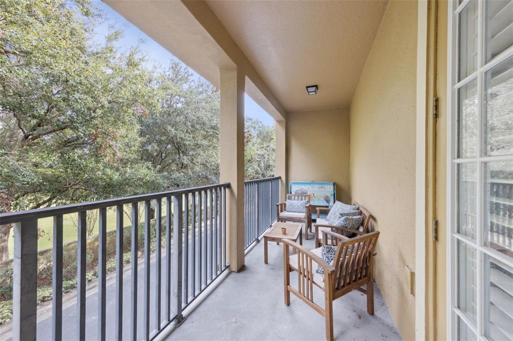 607 Pensacola Lane Lake Mary, FL 32746 - Photo 8 of 35 a balcony with couple of chairs and a potted plant
