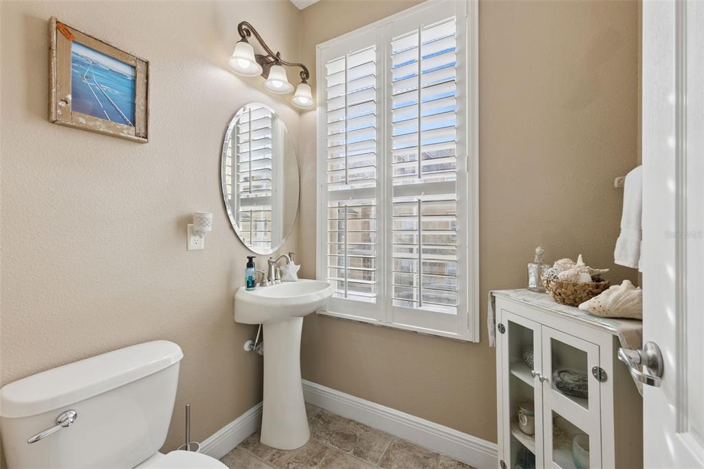 607 Pensacola Lane Lake Mary, FL 32746 - Photo 9 of 35 a bathroom with a sink a toilet and a window
