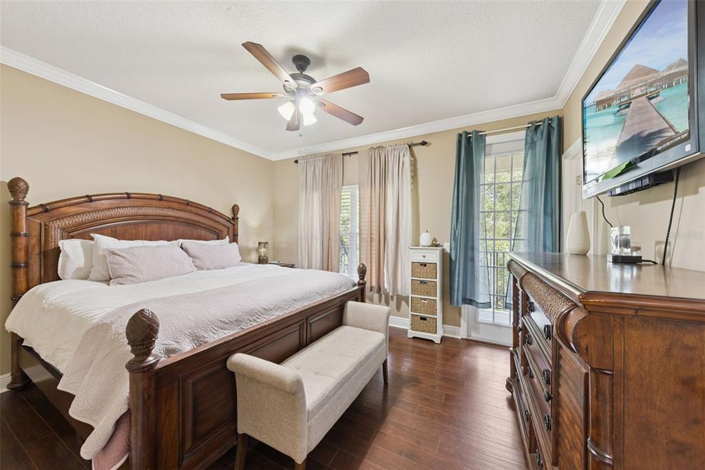 607 Pensacola Lane Lake Mary, FL 32746 - Photo 10 of 35 a bedroom with a bed and wooden floor