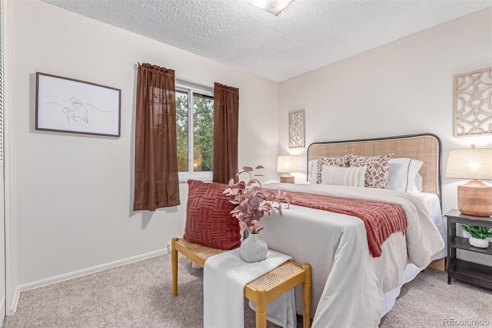 1285 Elder Street Denver, CO 80221 - Photo 13 of 35 a bedroom with a bed and a window