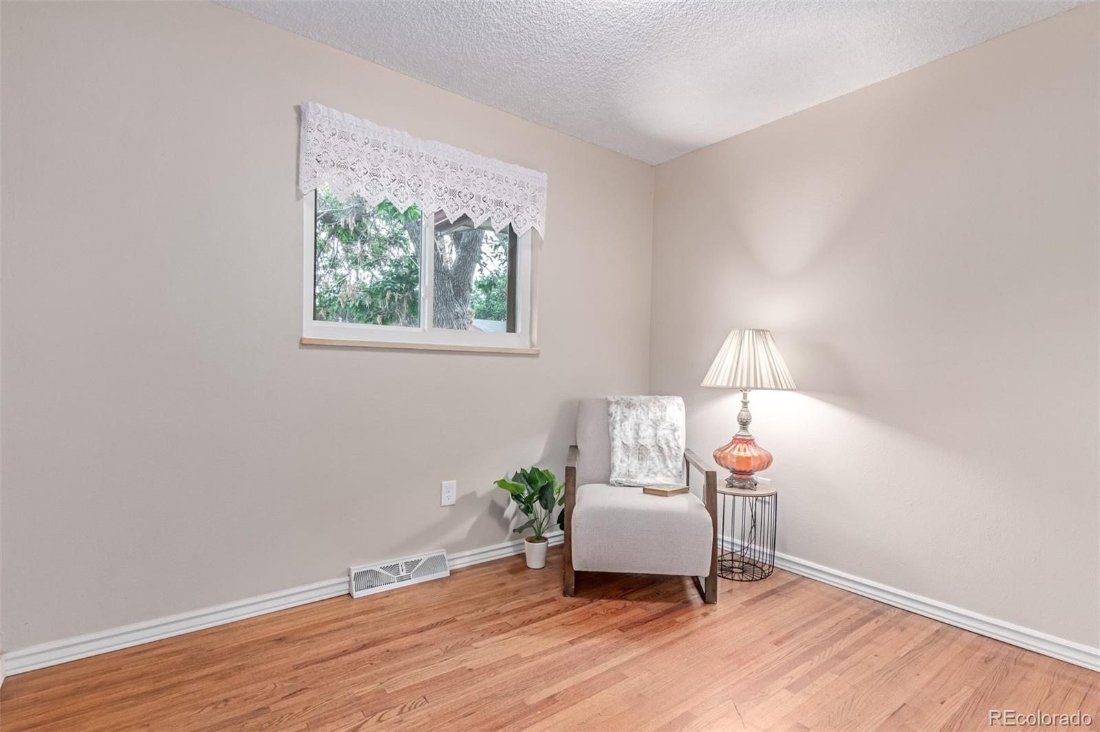 1285 Elder Street Denver, CO 80221 - Photo 16 of 35 a living room with furniture and a window