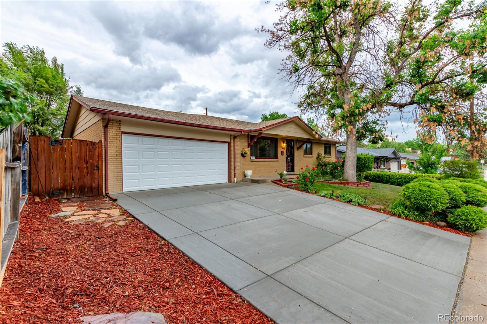 1285 Elder Street Denver, CO 80221 - Photo 2 of 35 front view of house with a yard