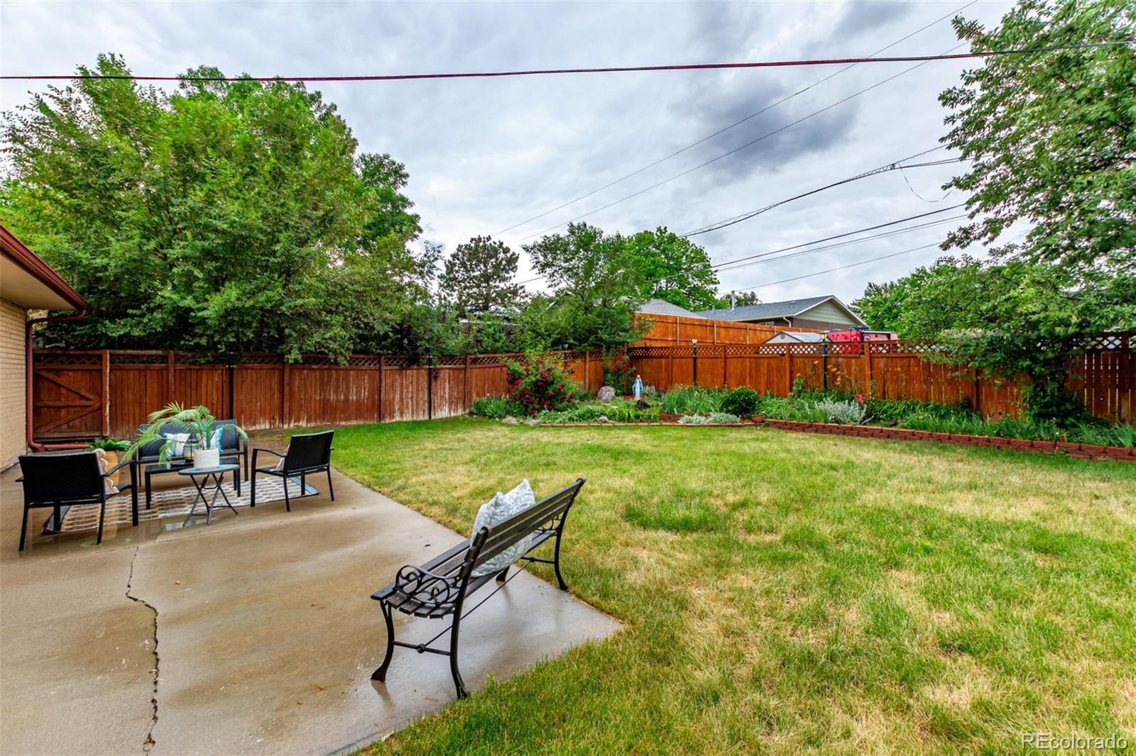 1285 Elder Street Denver, CO 80221 - Photo 30 of 35 a view of an outdoor sitting area in a backyard