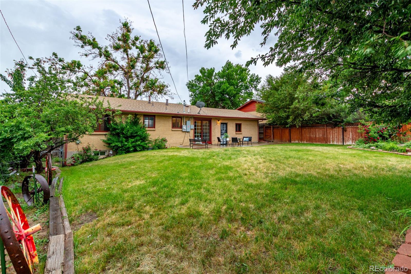 1285 Elder Street Denver, CO 80221 - Photo 33 of 35 a house view with swimming pool and garden space
