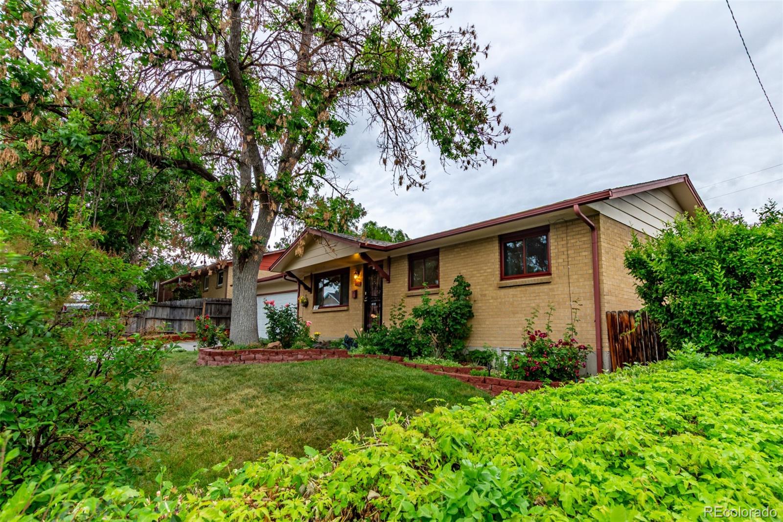 1285 Elder Street Denver, CO 80221 - Photo 4 of 35 a front view of house with yard and green space