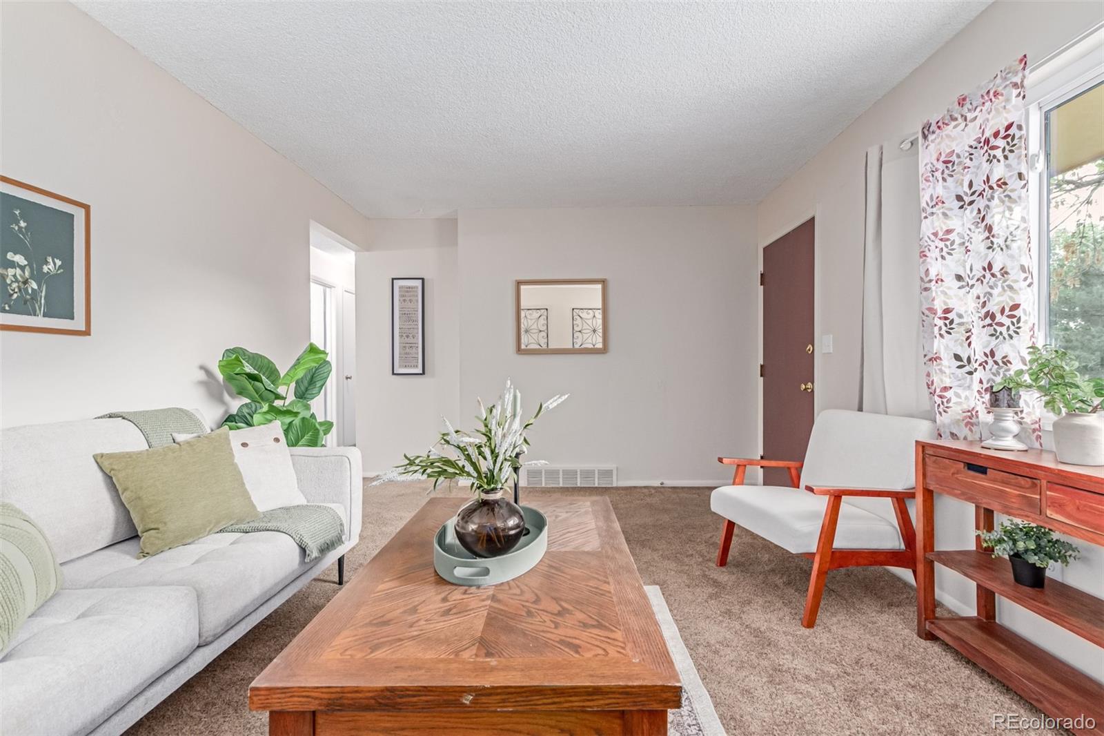 1285 Elder Street Denver, CO 80221 - Photo 7 of 35 a living room with furniture potted plant and a table