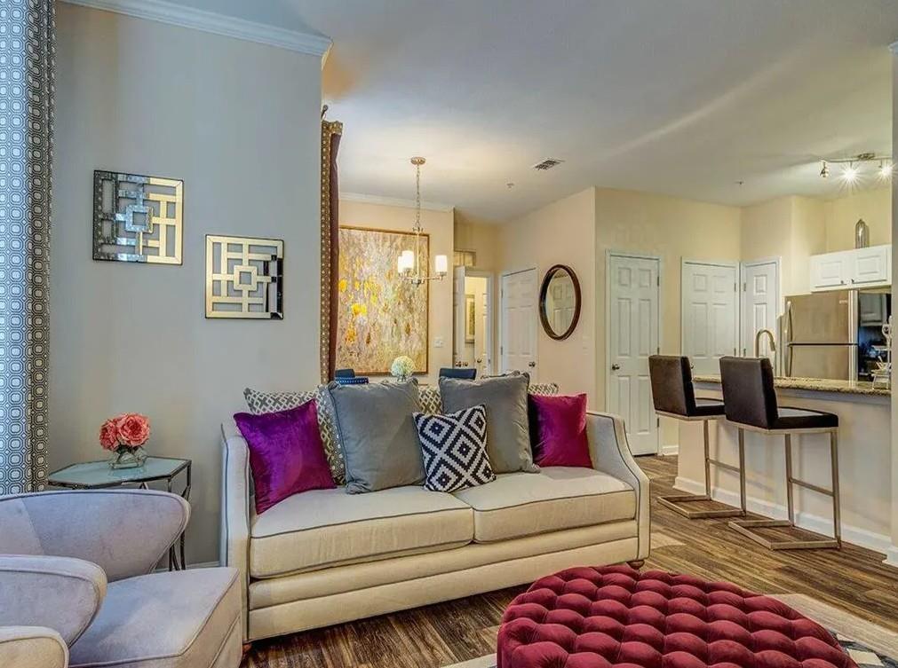 1600 Blairs Bridge Road, Unit 2302 Lithia Springs, GA 30122 - Photo 15 of 21 a living room with furniture a rug and a flat screen tv