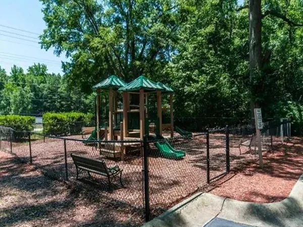 a view of a bench in the backyard