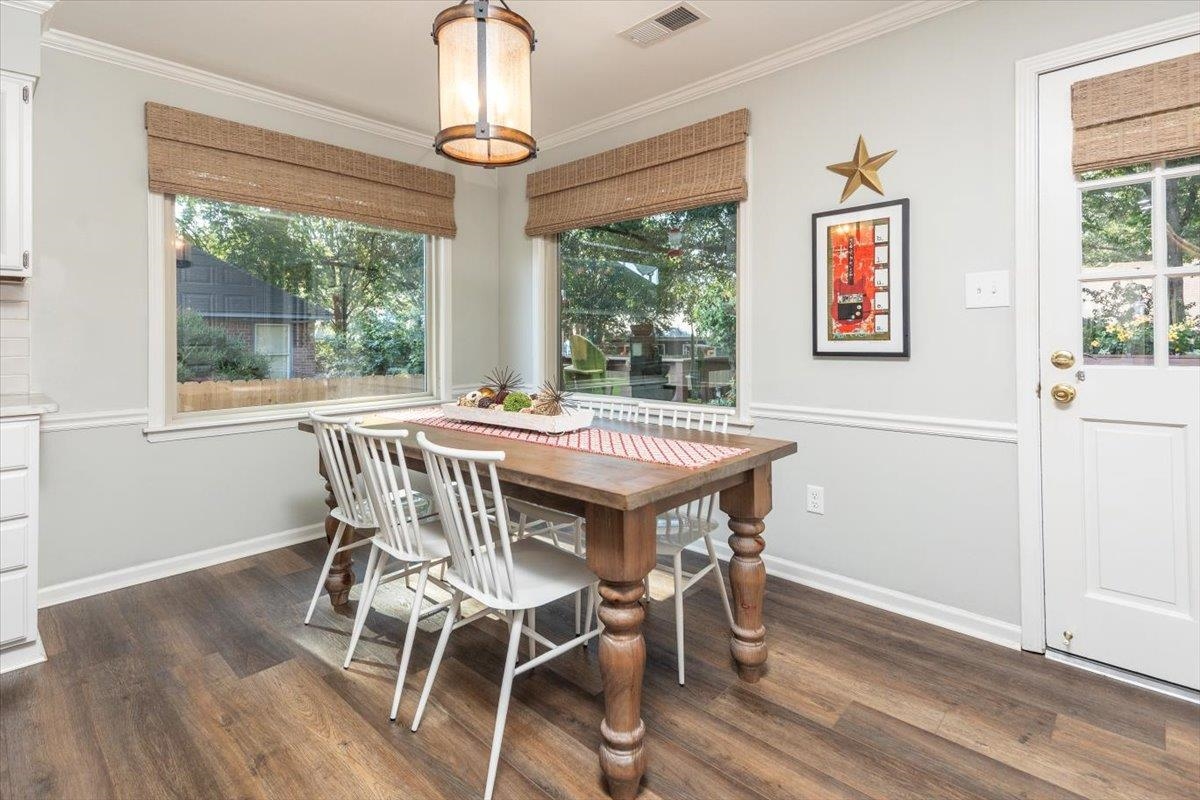 8523 Bazemore Road Memphis, TN 38018 - Photo 17 of 40 a view of a dining room with furniture window and wooden floor