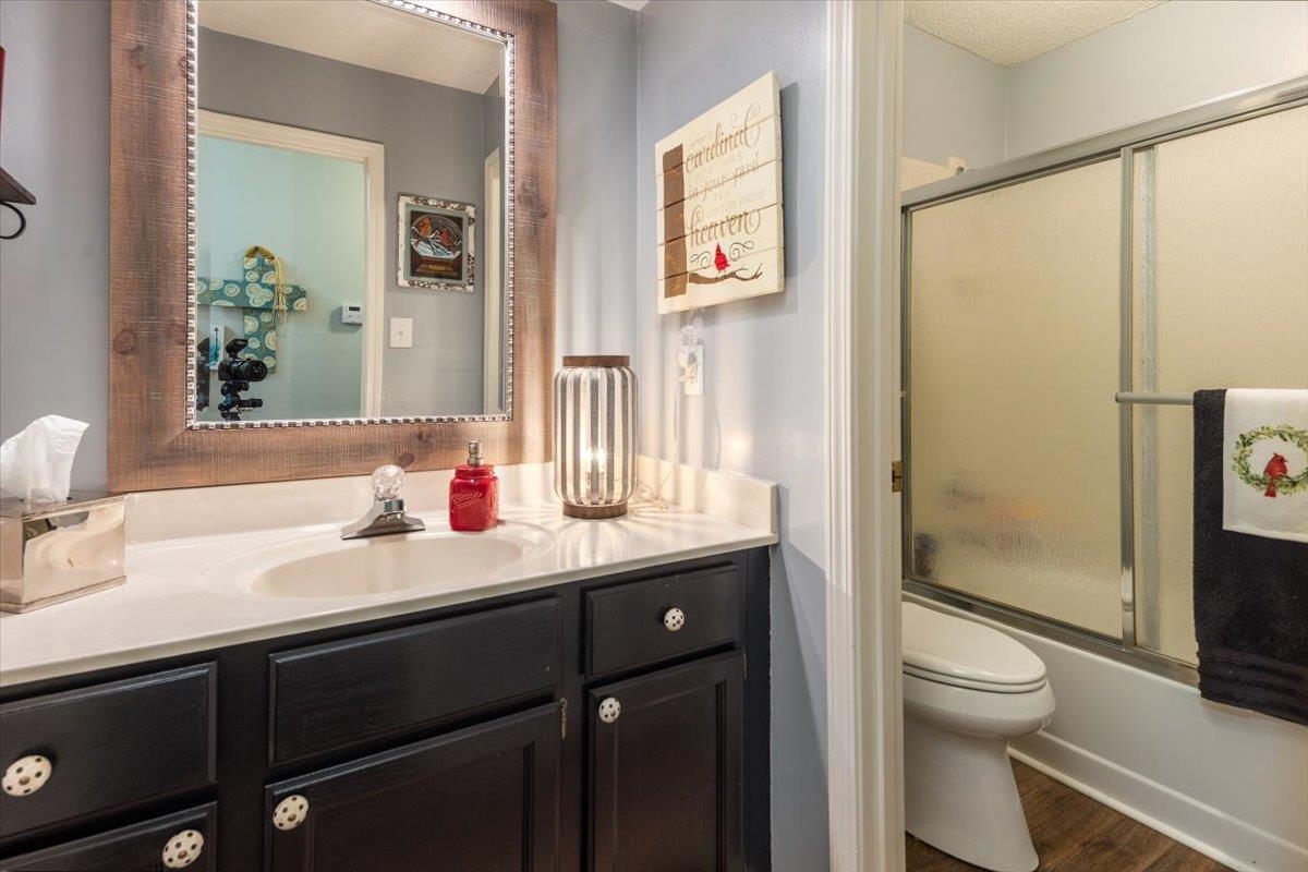 8523 Bazemore Road Memphis, TN 38018 - Photo 23 of 40 a bathroom with a granite countertop sink toilet and shower