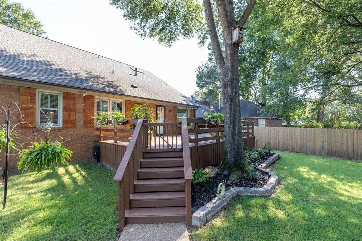 8523 Bazemore Road Memphis, TN 38018 - Photo 29 of 40 a view of a backyard with plants and a patio
