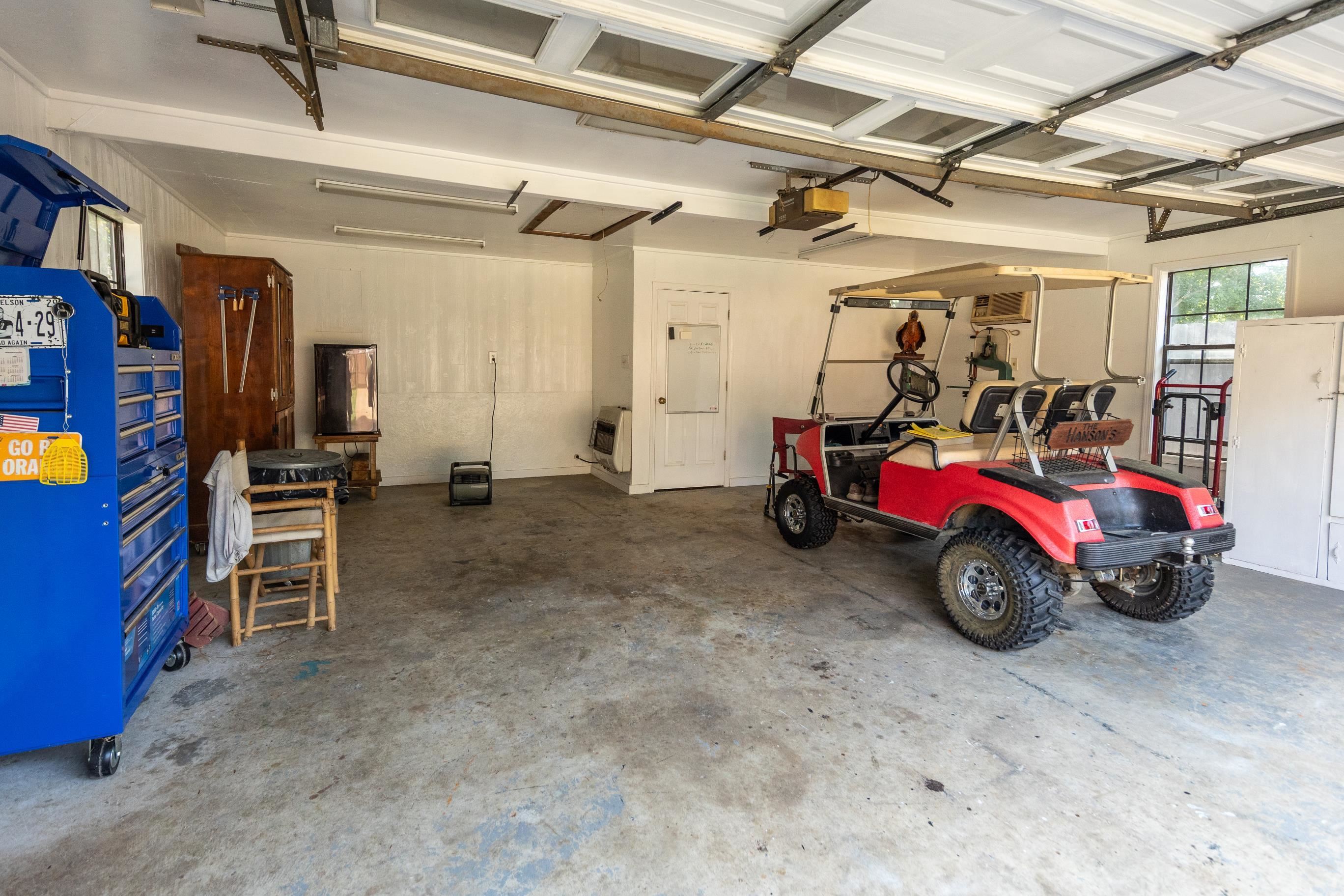 8523 Bazemore Road Memphis, TN 38018 - Photo 32 of 40 a view of a garage with parked cars