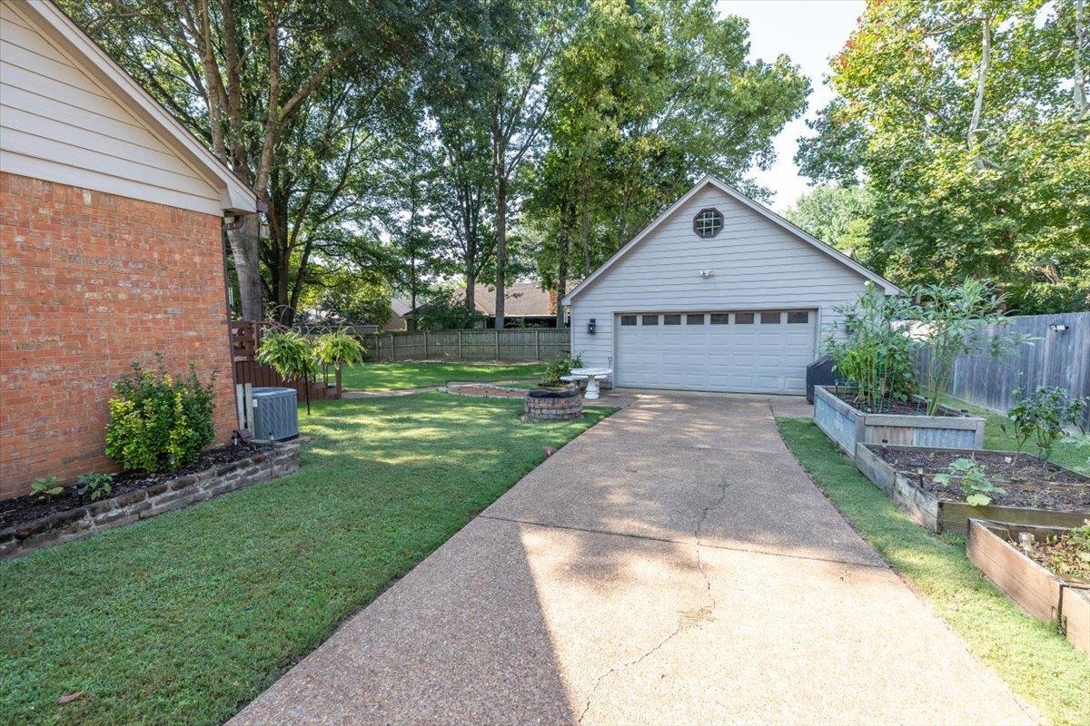 8523 Bazemore Road Memphis, TN 38018 - Photo 38 of 40 a view of a house with a yard and fence