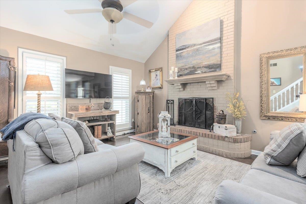 8523 Bazemore Road Memphis, TN 38018 - Photo 4 of 40 a living room with furniture fireplace and a large window